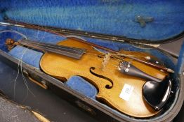 An antique Lion head violin probably from the Dresden region with 14 inch back
