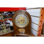 An inlaid bracket clock with brass side panels on brass ball feet with engraved dial AF