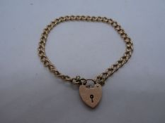 9ct rose gold curb link bracelet, with heart shaped clasp and safety chain, marked 375 , each link m
