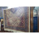 WITHDRAWN A modern rug with central diamond motif