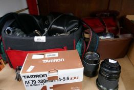 A selection of 35mm cameras and lenses including Praktica, Chinon and Harimex