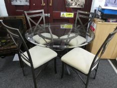 Contemporary glass top circular dining table on metal base and a set of 4 matching chairs
