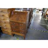 A reproduction mahogany ladies bureau having three drawers