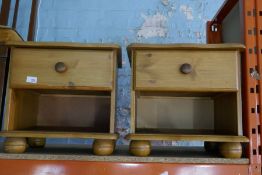 A pair of modern pine bedside tables