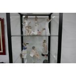 Six Nao figurines and one Lladro example