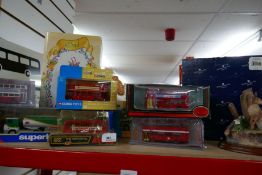 A selection of Corgi die cast model buses etc plus two boxed animal figures, etc