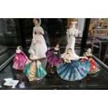 A quantity of Royal Doulton figurines and one coalport example (7)