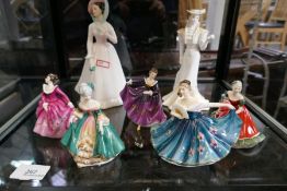 A quantity of Royal Doulton figurines and one coalport example (7)