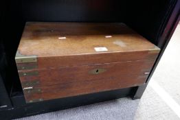 An antique mahogany campagna style desk slope having brass decoration