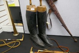 Assorted riding whips and a pair of riding boots