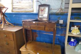 An antique mahogany ladies dressing table with central lift up mirror and sliding drawers and applie