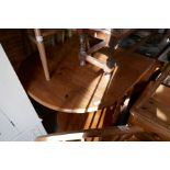 Waxed pine drop flap oval kitchen table and 5 hoop and stick back chairs