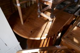 Waxed pine drop flap oval kitchen table and 5 hoop and stick back chairs