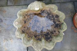 Stone effect weathered garden bird bath of scalloped form