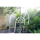 Wrought iron garden screen and candle stand