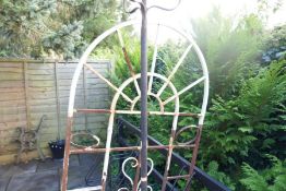 Wrought iron garden screen and candle stand