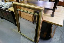A gilt framed rectangular wall mirror and pine framed example, largest 81cm