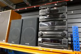 A Kenwood music centre and Akai Stereo and 2 pairs speakers