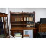 Large mahogany sideboard with galleried top open shelves and four cupboards on bun supports