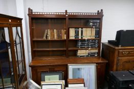 Large mahogany sideboard with galleried top open shelves and four cupboards on bun supports