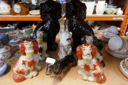 A quantity of porcelain dog figures, including Beswick, etc