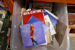 Two boxes of various 1980s singles and a case of similar