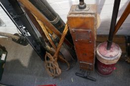 A collection of vintage carpet sweepers, hoovers, bed pans etc
