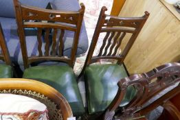 A set of 4 mahogany barback dining chairs with green leather seats