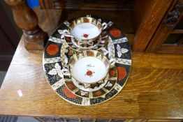 A large collection of dinnerware with gilded Imari decoration by Abbeydale Derbyshire Chrysanthemum