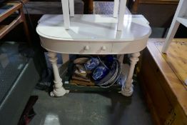 A cream painted Victorian dressing table with single drawer on turned supports