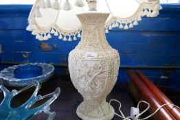 A large white resin table lamp AF, with all over oriental decoration