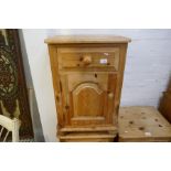 Three stripped pine bedside cabinets, each with a drawer and cupboard