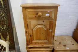 Three stripped pine bedside cabinets, each with a drawer and cupboard