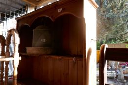 Waxed pine kitchen dresser with open rack above drawers and cupboards