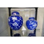 Two blue and white Chinese ginger jars, complete with original lids and a pair of decorative vases