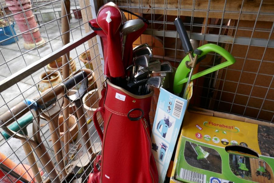 Red leather golf bag containing various Dunlop and Pinseeker clubs (left handed)