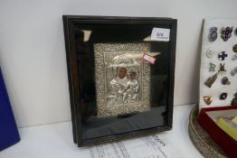 A Greek miniature icon of the Mother of God Hodigitria, encased in a silver Oklad, in a fitted glass