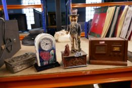 Cast iron money bank, two cigarette boxes and an Art Nouveau style clock