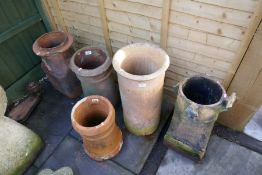 Five various sized and shaped terracotta garden chimney pots, some AF