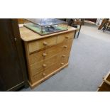 Stripped pine chest of two short over three long drawers