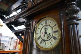 A victorian mahogany bracket wall clock with applied face mask, decoration and enamel dial