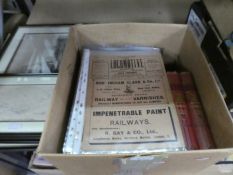 A box containing a collection of The Locomotive magazine from early 1900s and 2 books on railways