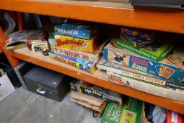 A selection of various board games, model cars, trains etc