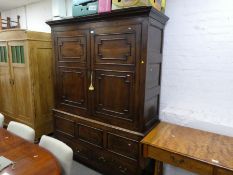 An antique bacon cupboard having panelled doors with 2 drawers to base, 155cm