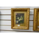 A pair of late 19th Century oil on canvas depicting primroses and pansies