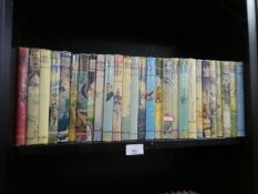 Two shelves of various vintage hardback children's novels to include Vanity Fair, etc, Demon & Son p