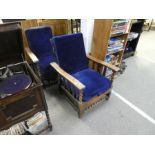 Two vintage oak framed steamer armchairs on oak twist support