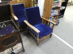 Two vintage oak framed steamer armchairs on oak twist support
