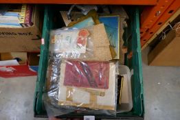 A box of mixed military items including plaques, badges, buttons, tins etc