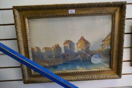 Gilt framed and glazed watercolour depicting a French river scene, signed indistinctly, and a black